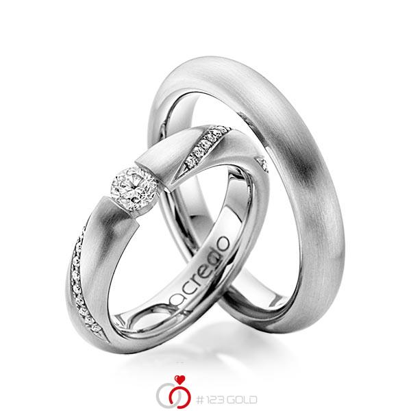 Set klassieke trouwringen in grijsgoud 14 kt. met 0,3 ct. + in totaal 0,225 ct. Briljant tw/si van acredo - A-1106-4 Set klassieke trouwringen in grijsgoud 14 kt. met 0,3 ct. + in totaal 0,225 ct. Briljant tw/si van acredo - A-1106-4